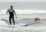 Professional surfer Taylor Knox and Zoey, a seven year old Jack Russell Terrier. Photo: Purina/ Gus Ruelas