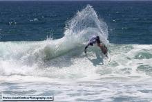 Surfer carving it up at the Pi Beta Phi Surf Classic